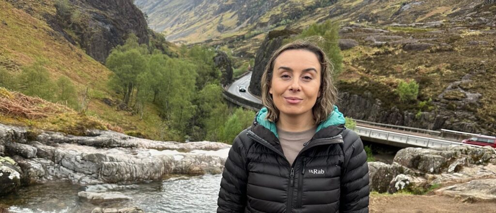 Gemma from Hiya Scotland Blog in front of a river at Glen Etive in Scotland