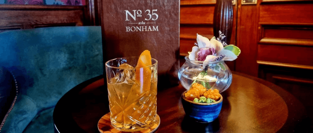 Whisky cocktail and nibbles at The Bonham