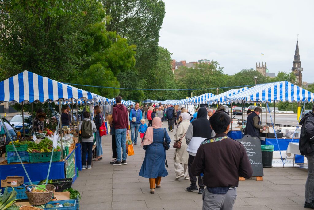 Busy stalls and fresh produce at the scenic Edinburgh Farmers Market