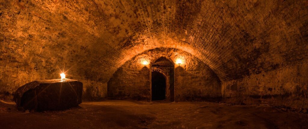 Edinburgh underground dungeon halls lit by torchlight