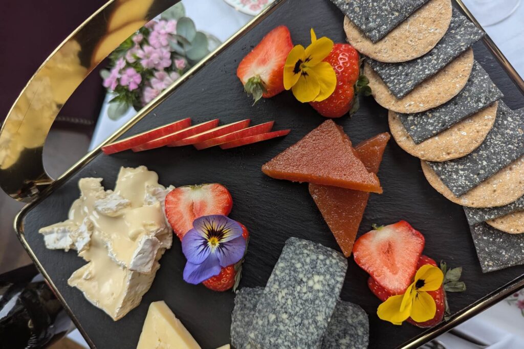 flat lay shot of cheese and crackers on a stand
