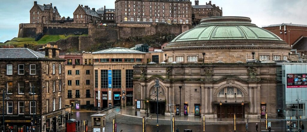 Edinburgh Usher hall with edinburgh castle in the background