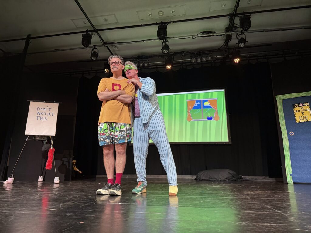 two men dressed in bright clothing on stage at The Listies Kids show edinburgh fringe