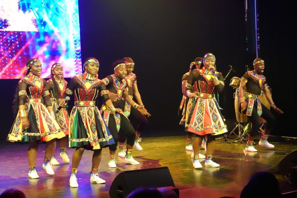 Ndlovu Youth Choir singing on stage at the edinburgh fringe